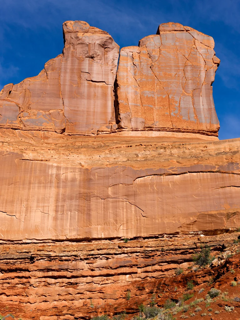 Sandstone Cliffs Against Blue Sky in Arches National Park