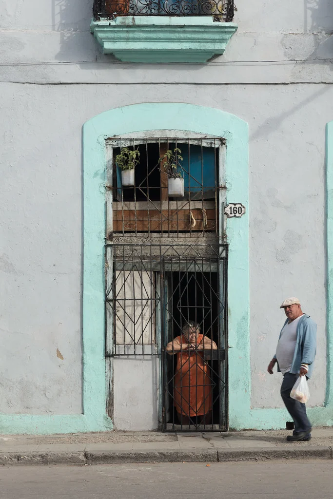 Old Lady In Doorway And Man Havana Cuba 2018