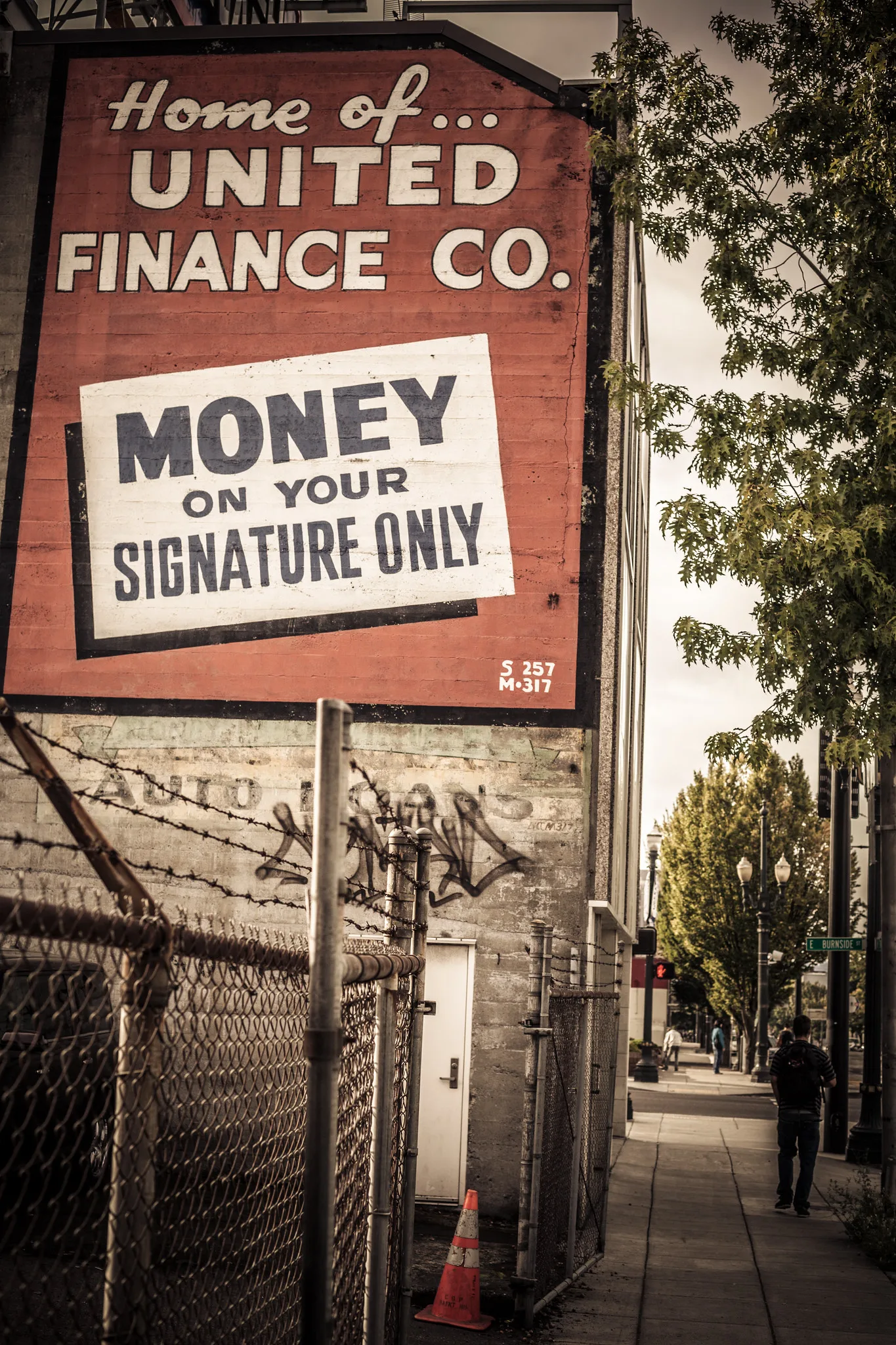 Old painted wall signs reading Home of United Finance Co and Money on Your Signature Only, a reminder that clear labels make things easy to find